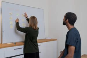 Women Teaching candidate on white board