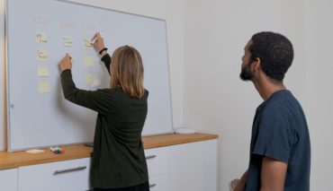 Women Teaching candidate on white board